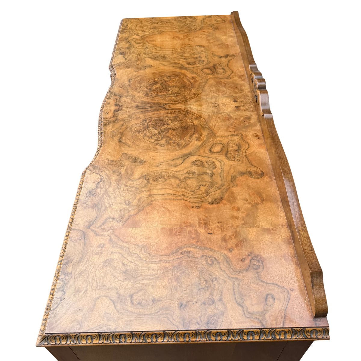 Lower apron and carved centre ornament on the vintage burr walnut sideboard