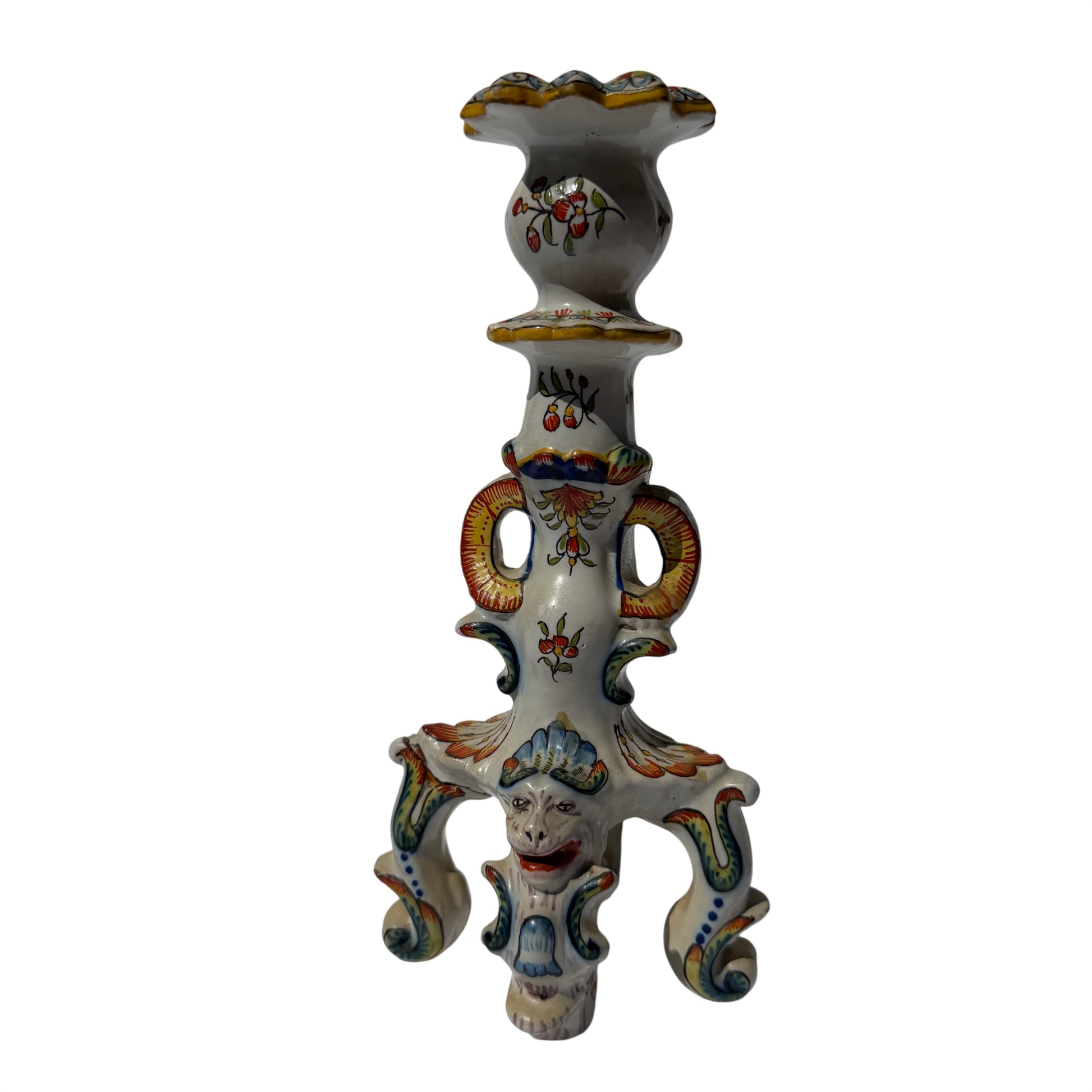 Hand-painted Rouen faience-style ceramic candlestick with grotesque mask and scrolling feet