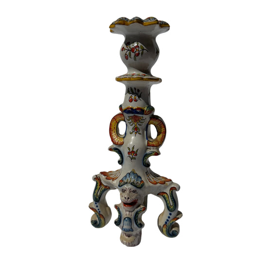 Hand-painted Rouen faience-style ceramic candlestick with grotesque mask and scrolling feet