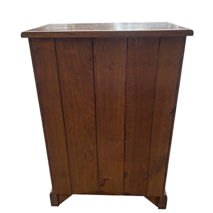 Close up of oak drawer with brass handles on wine rack cabinet