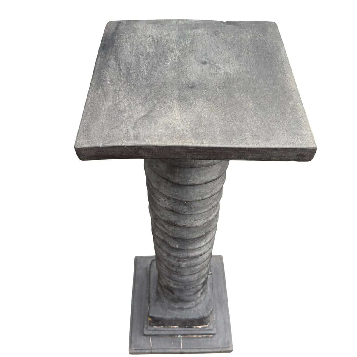 Square stepped plinth base of vintage wooden display pedestal with paint wear