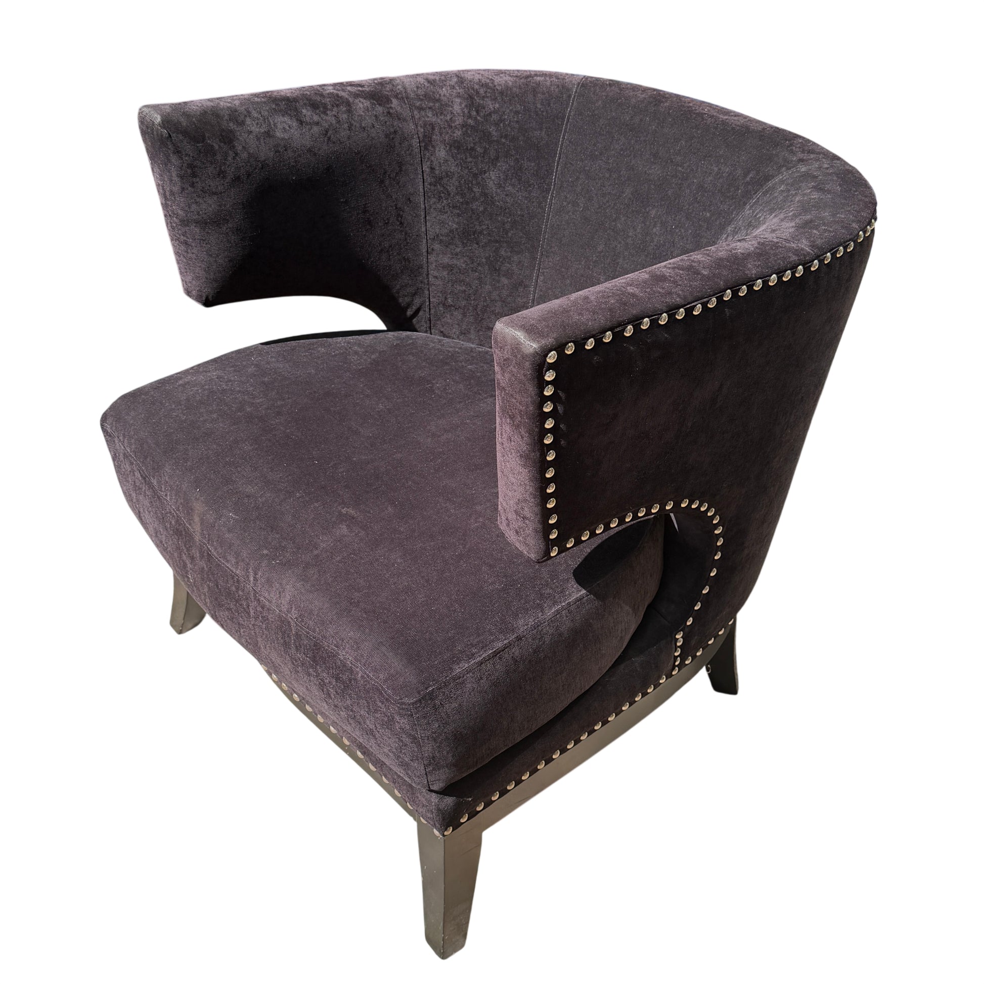 Large rounded seat cushion of black velvet-effect armchair with timber legs