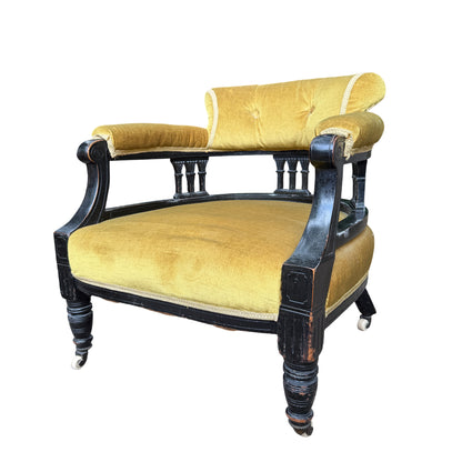 Victorian ebonised armchair in mustard velvet with buttoned back and original ceramic castors