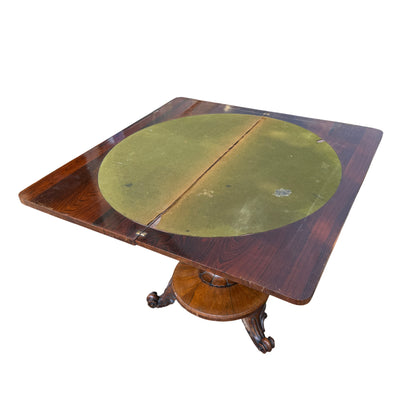 Walnut pedestal occasional table with turned column and carved tripod base