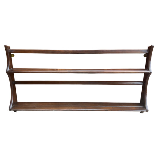 Ercol mid-century three-tier wall-mounted plate rack in dark-stained wood with maker's label visible