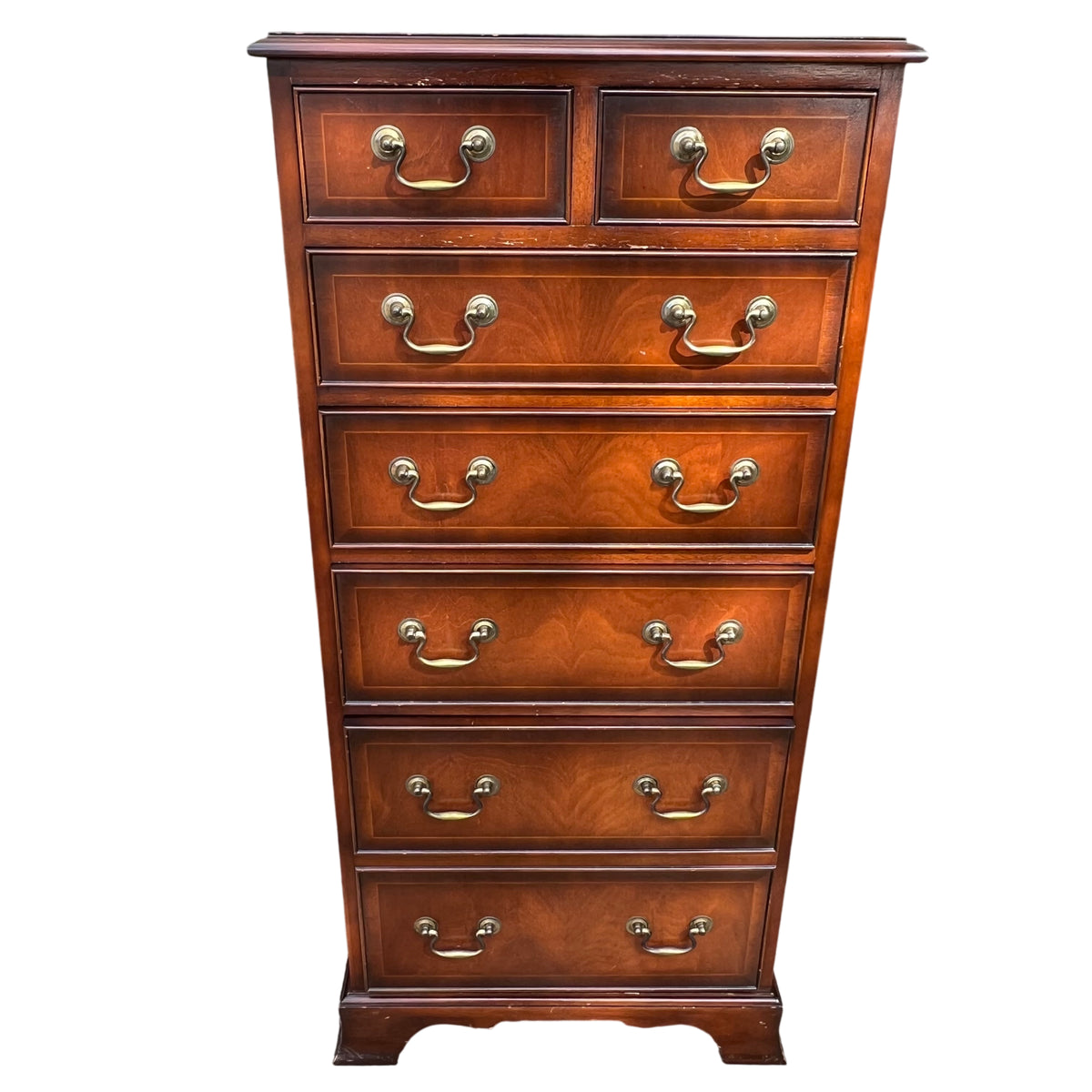 Front close up of mahogany tall chest of drawers with two small top drawers and brass drop handles