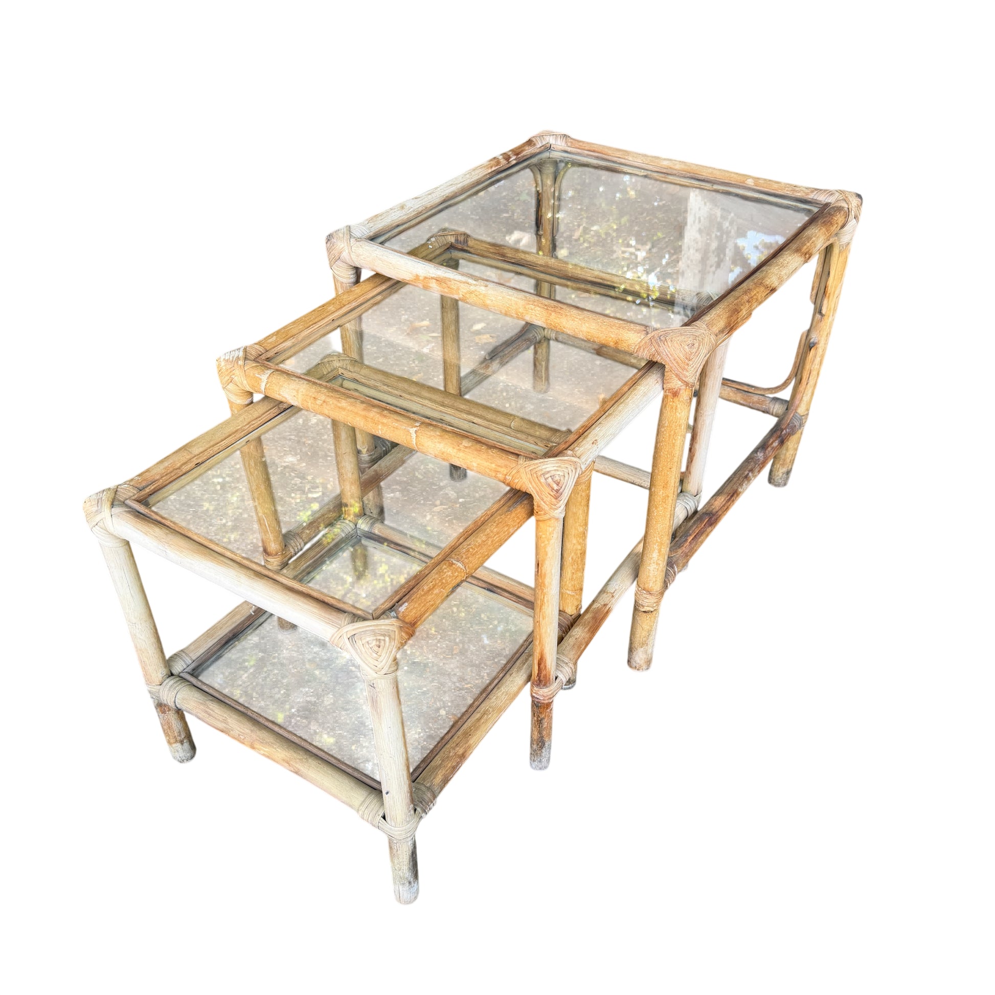 Vintage rattan nest of 3 tables with clear glass tops and cane-wrapped corners