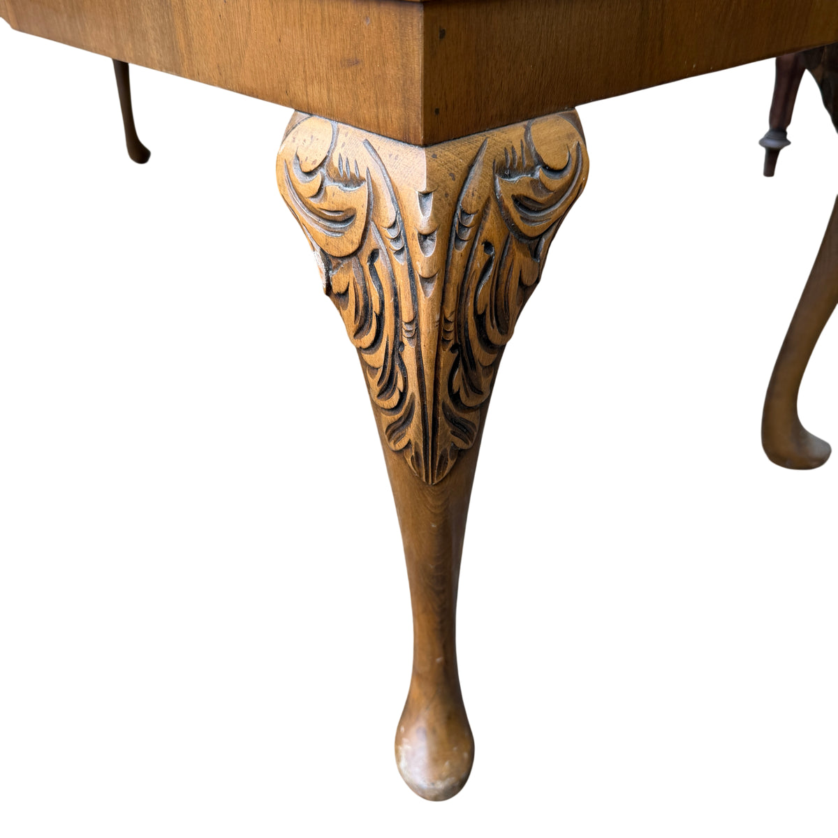 Detail of carved cabriole leg with carved acanthus motif on vintage sideboard