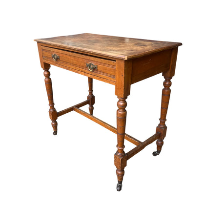Victorian pine side table with single drawer turned legs and castors