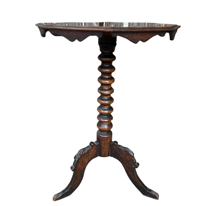 Close-up of octagonal walnut top with visible grain and original finish on small side table