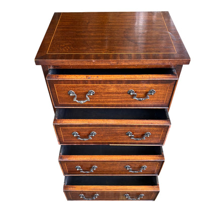 Full height view of narrow tallboy chest with five pairs of brass handles and shaped base