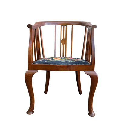 Arts & Crafts tub armchair with curved top rail, vertical slatted back and needlepoint upholstered round seat
