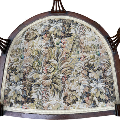 Floral tapestry upholstered seat on vintage mahogany armchair