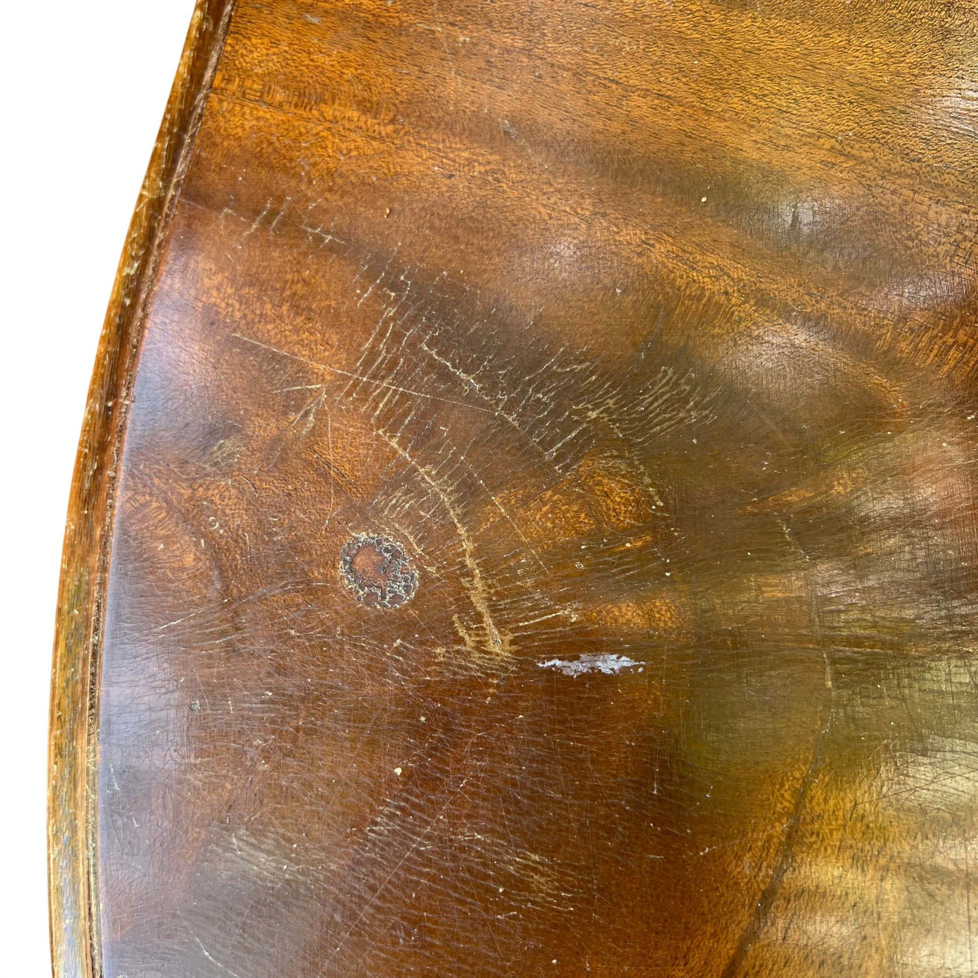 Moulded top edge of mahogany bedside chest with aged finish