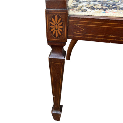 Side view of Edwardian mahogany tub chair showing shaped leg