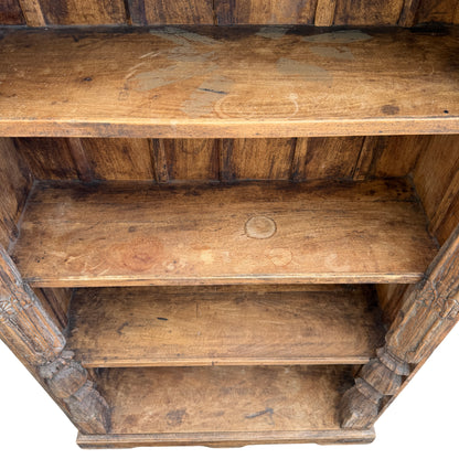 Top cornice profile and carved frieze detail on oak bookcase