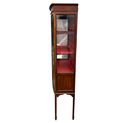 Front view of an Edwardian mahogany vitrine with arched leaded glazing
