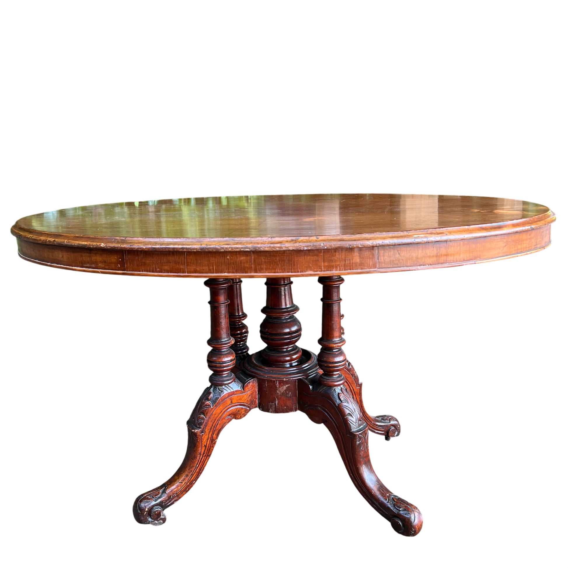 Round mahogany tilt-top dining table with turned central pedestal