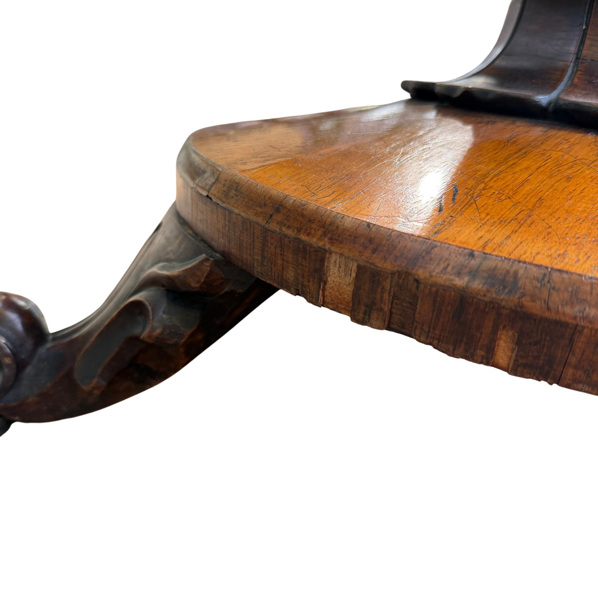 Square tilt-top showing wood grain and baize lining on antique table