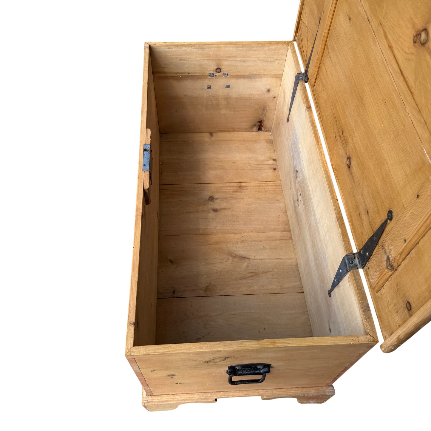 Corner detail of dovetailed joint on pine storage chest