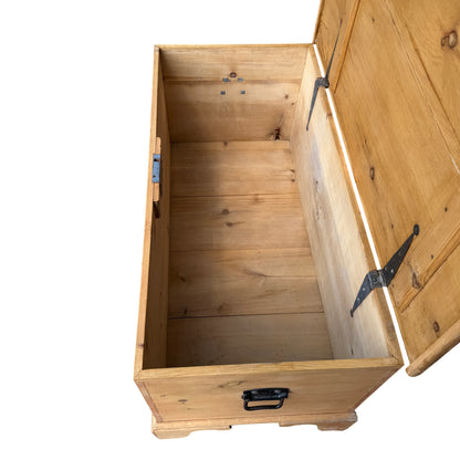 Corner detail of dovetailed joint on pine storage chest