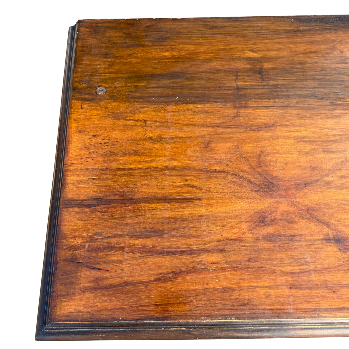Angled view of carved wooden sideboard showing drawer fronts and doors