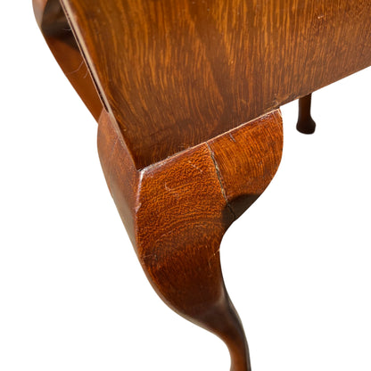 Top edge of bedside cabinet showing seam and curved moulding