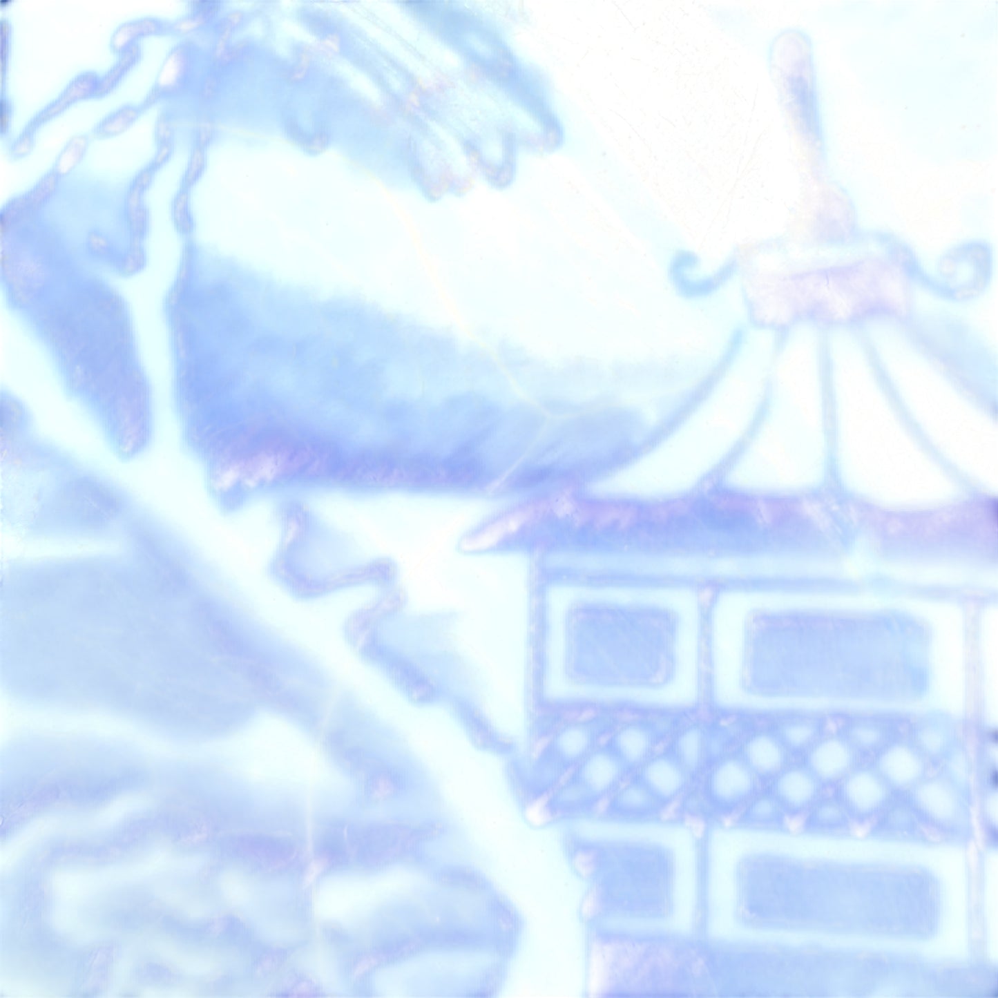 Edge detail and rim of antique blue transferware plate with minor rubbing visible