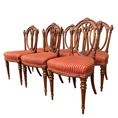 Set of six Victorian carved dining chairs with red and gold striped upholstered seats, front view