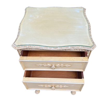 Top view showing shaped glass top and painted decorative edging on bedside chest