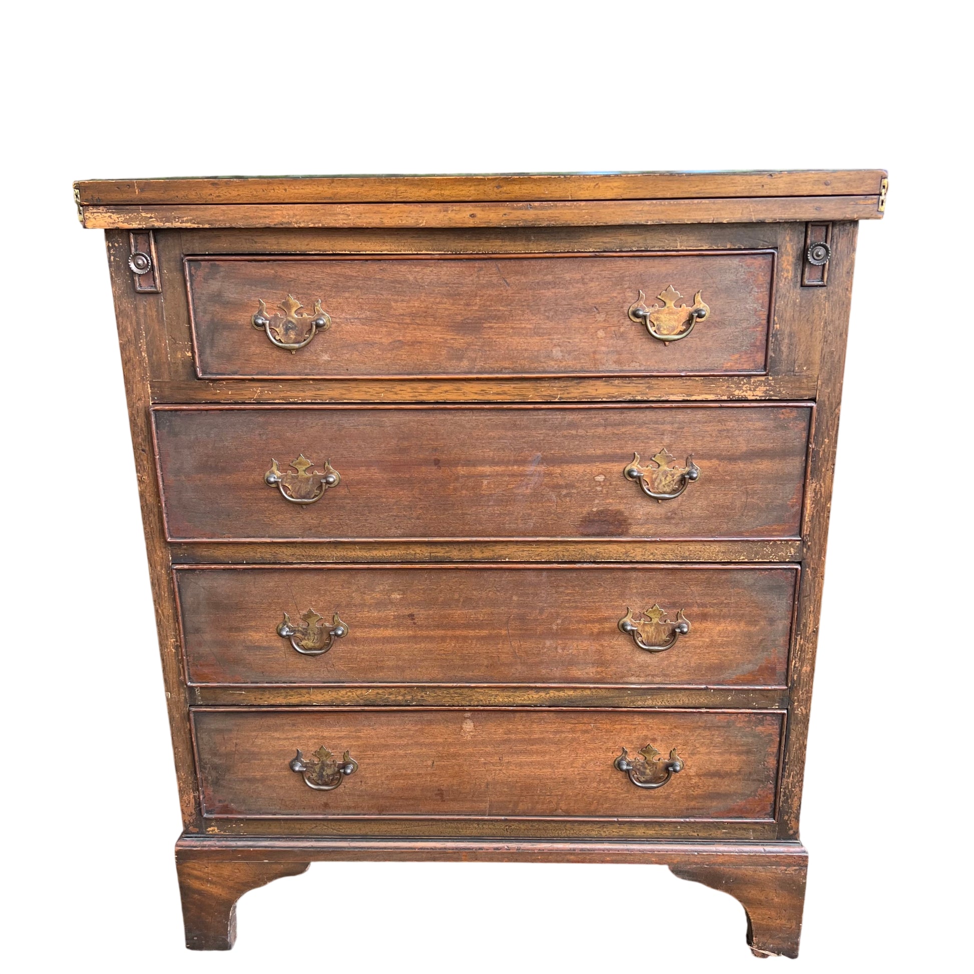 Close-up of brass drop handles on an oak chest of drawers