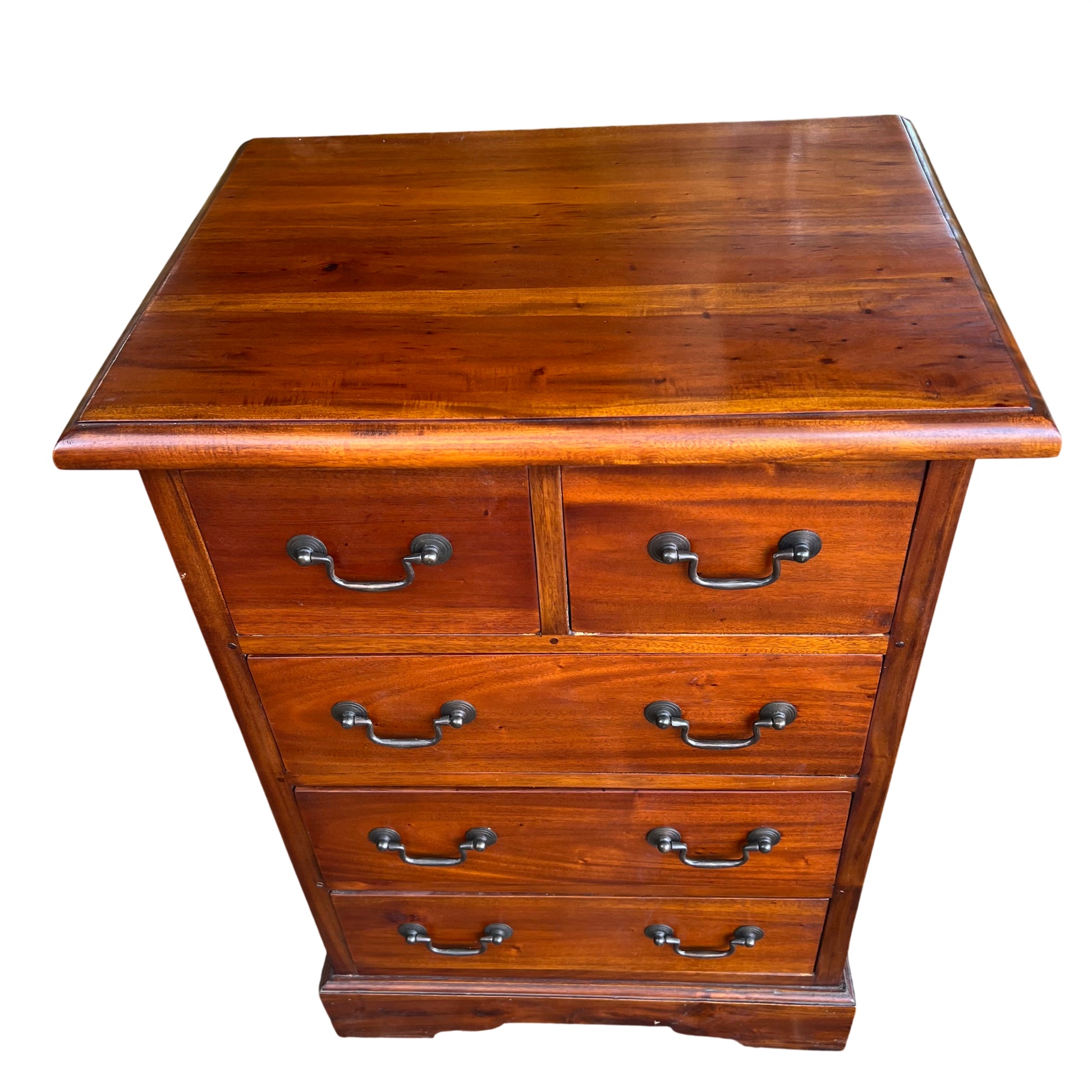 Close-up of top surface showing stained hardwood grain and finish on chest of drawers