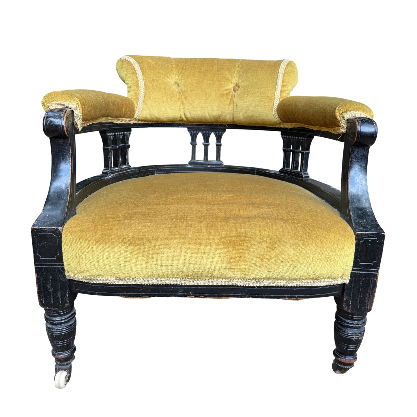 Top view showing buttoned back of Victorian armchair upholstered in olive mustard velvet