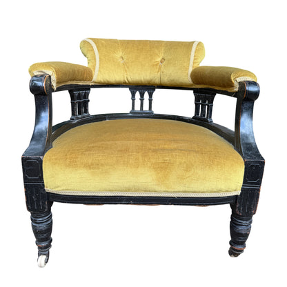 Top view showing buttoned back of Victorian armchair upholstered in olive mustard velvet