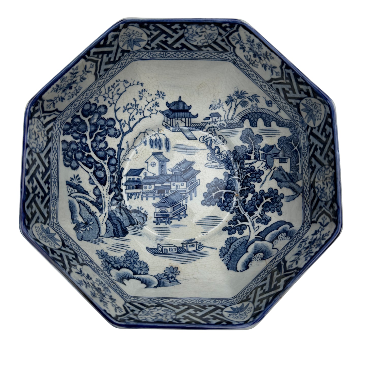 Close view of octagonal rim and decorative transferware border on porcelain bowl