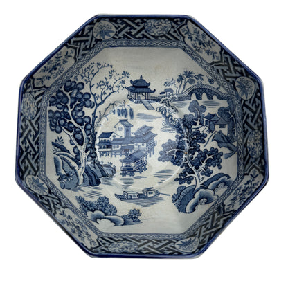 Close view of octagonal rim and decorative transferware border on porcelain bowl