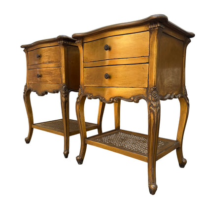 Pair of gold painted bedside cabinets with two drawers and caned lower shelves