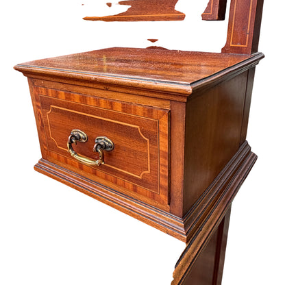 Upper drawers and inlay detail on vintage mahogany dressing chest