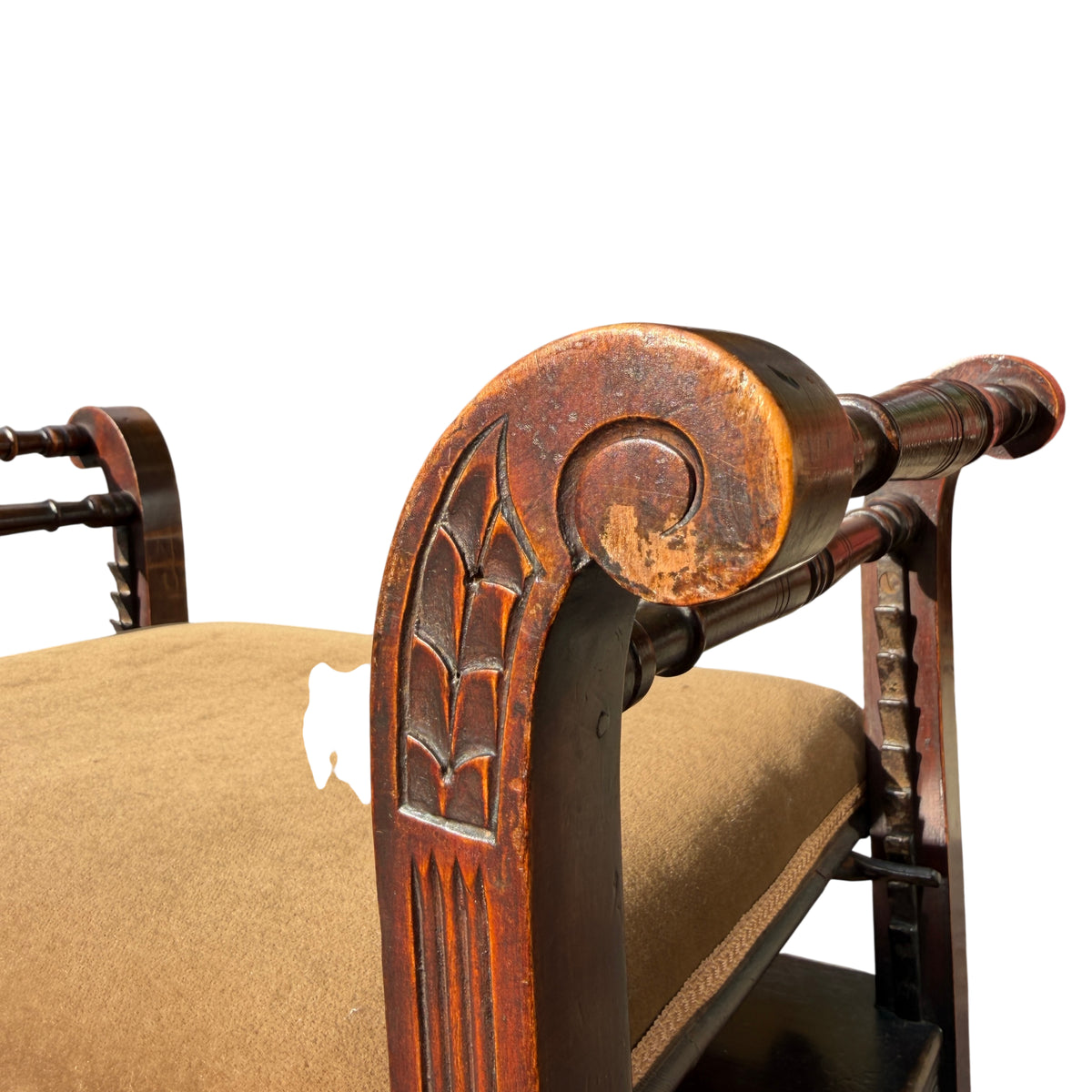 Detail of carved apron and drawer underside of Victorian upholstered stool