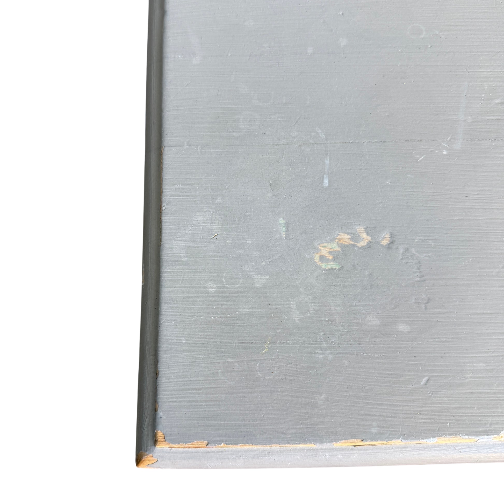 Middle section of painted pine chest showing drawer fronts and paint chips