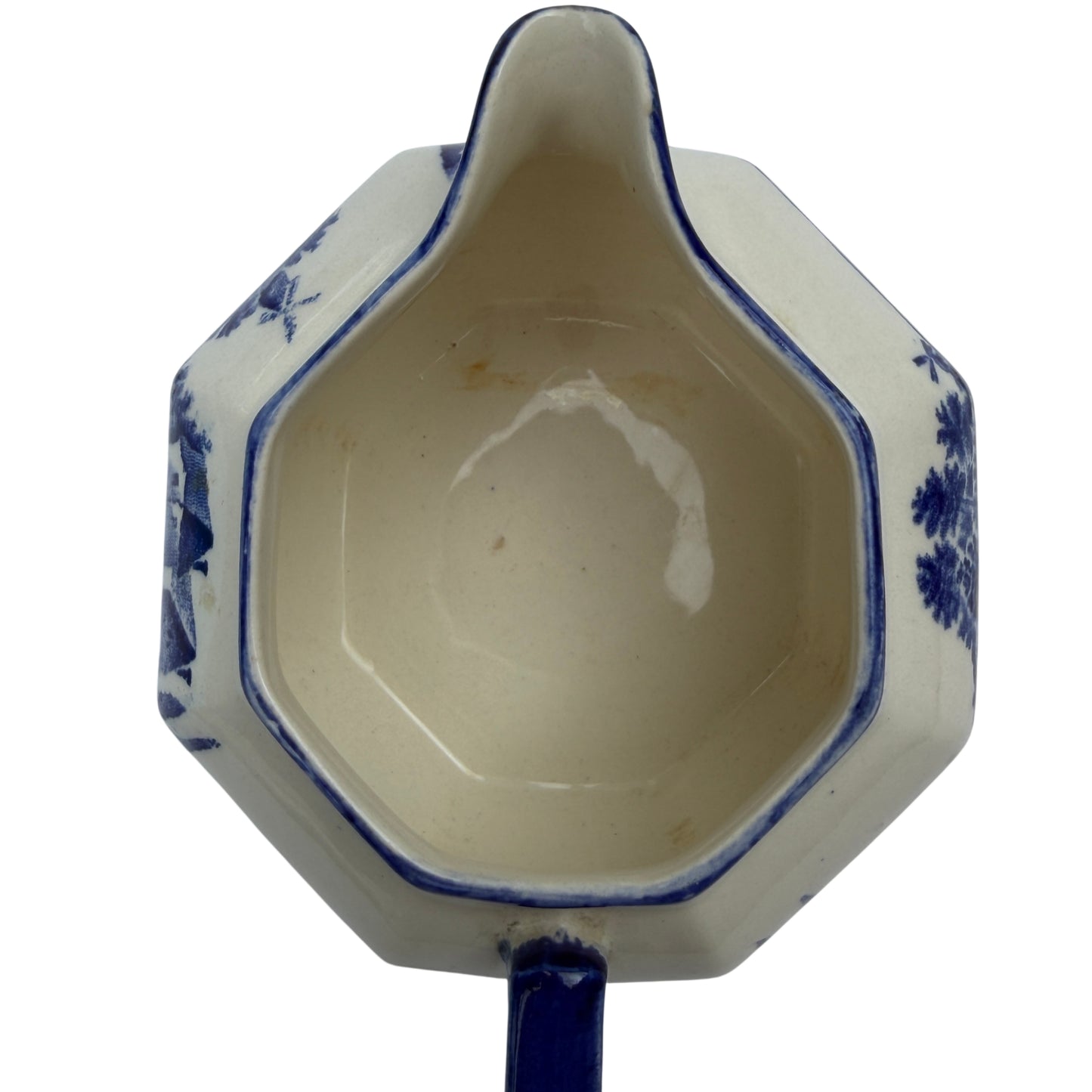Shaped pouring spout and blue rim detail on Victorian transferware jug