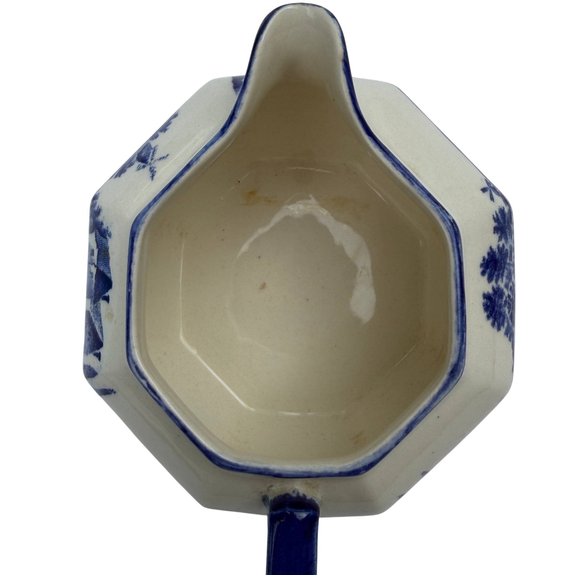 Shaped pouring spout and blue rim detail on Victorian transferware jug