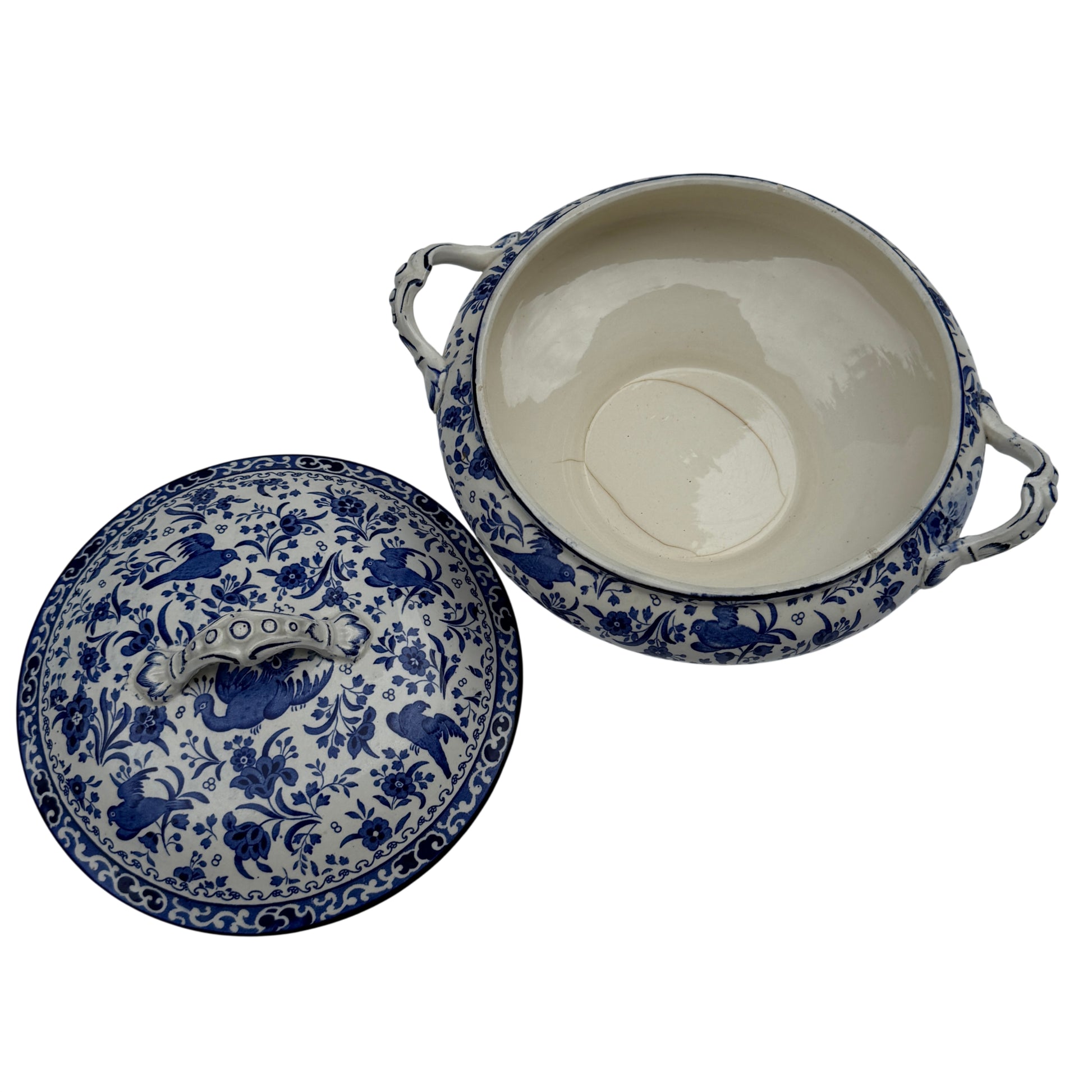Edge view showing the rim pattern and minor glaze wear on the tureen lid