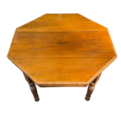 Top view of octagonal oak coffee table showing plank construction and warm finish