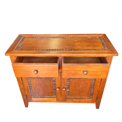 Close-up of cabinet top showing simple moulded edge and oak finish