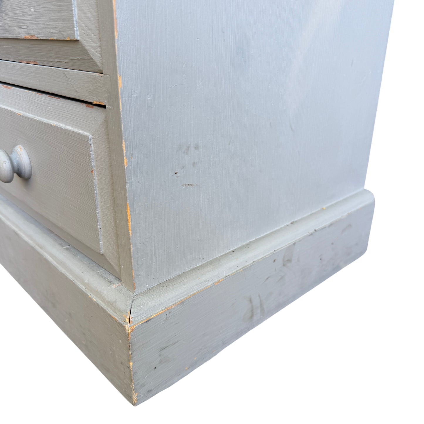 Detail of brush marks and painted finish on vintage pine chest top surface