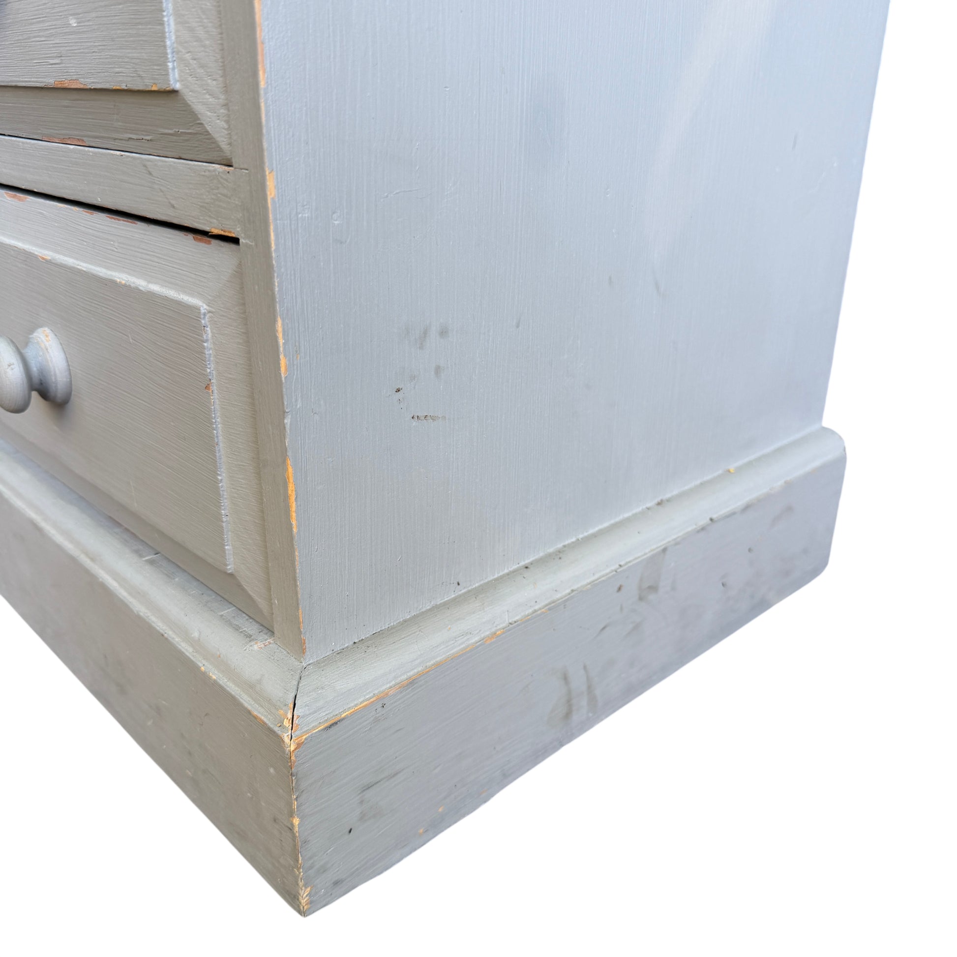 Detail of brush marks and painted finish on vintage pine chest top surface