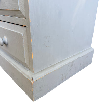 Detail of brush marks and painted finish on vintage pine chest top surface