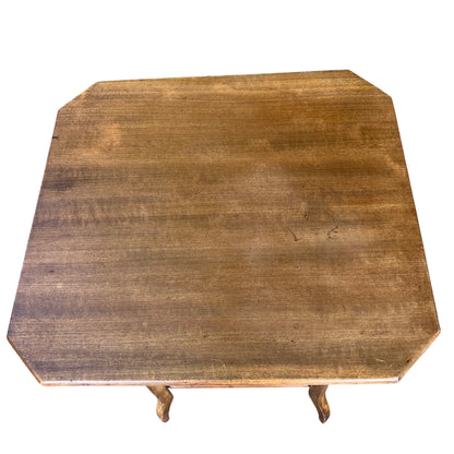 Detail of table top edge showing small knocks and scuffs on the finish