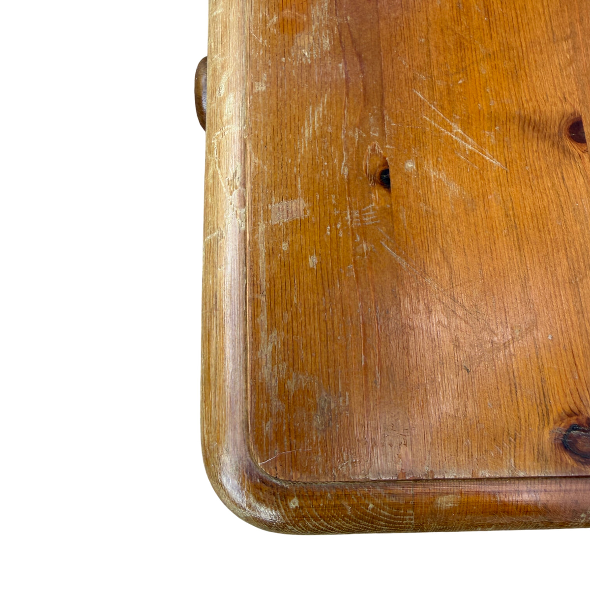 Side view of solid pine chest showing rounded top edge and plinth base